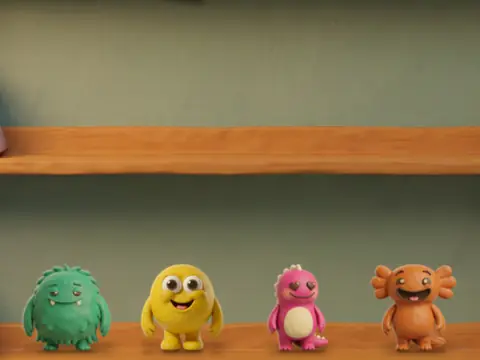 The bookshelf wall with four little monsters on its shelf